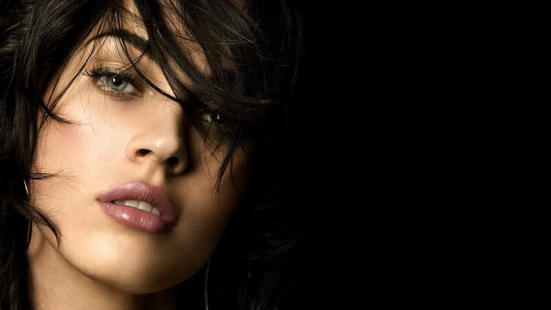 woman with dark hair and green eyes