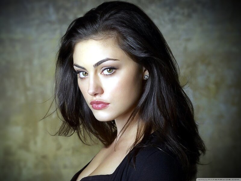 woman with dark hair and green eyes
