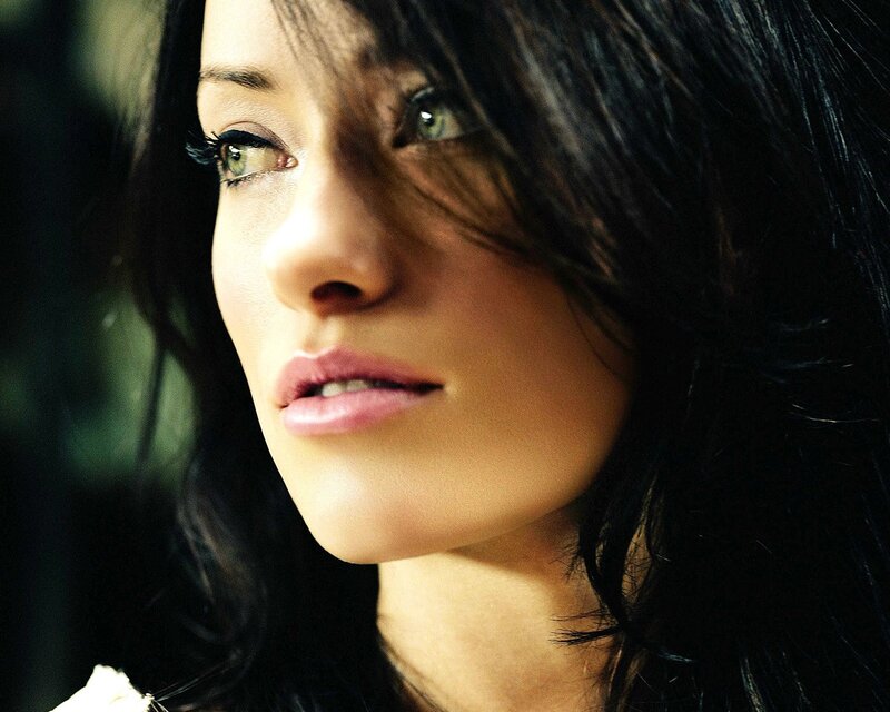 woman with dark hair and green eyes