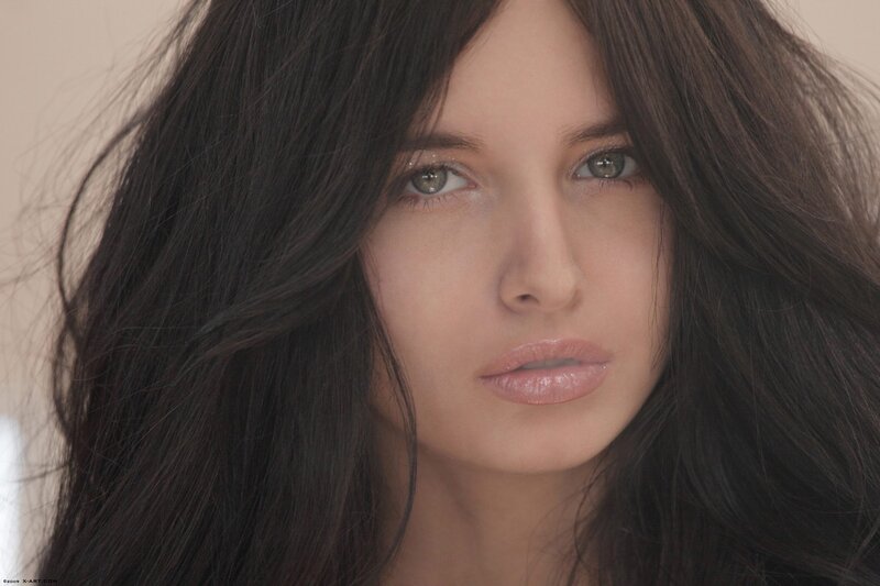 woman with dark hair and green eyes