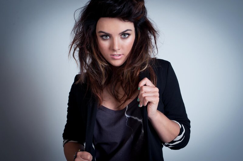 woman with dark hair and green eyes
