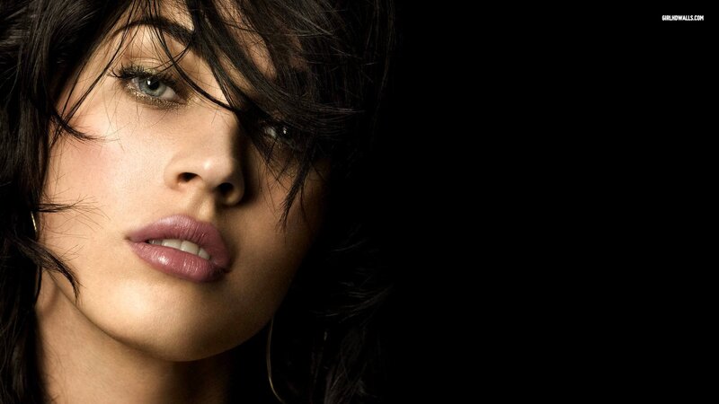 woman with dark hair and green eyes