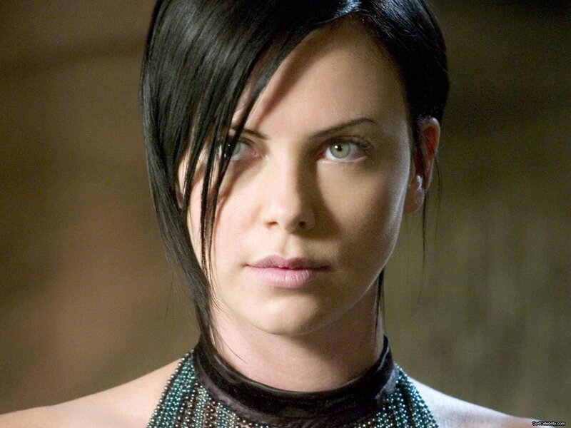 woman with dark hair and green eyes