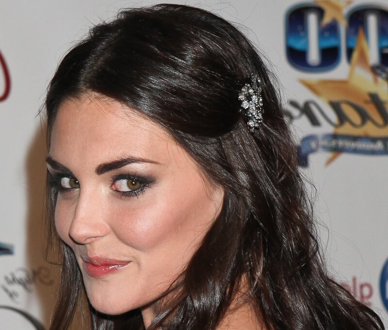 woman with dark hair and hair accessory