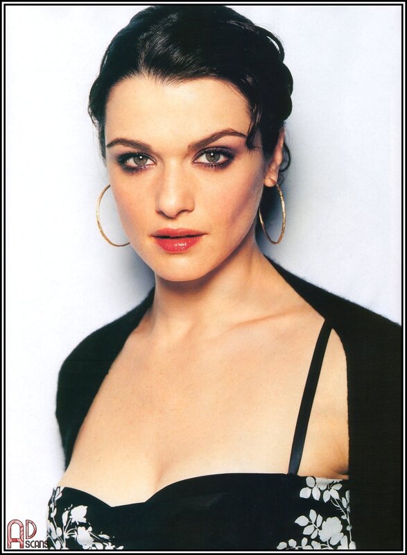 woman with dark hair and hoop earrings