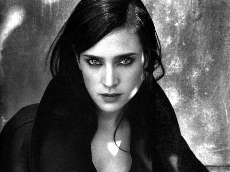 woman with dark hair and intense gaze