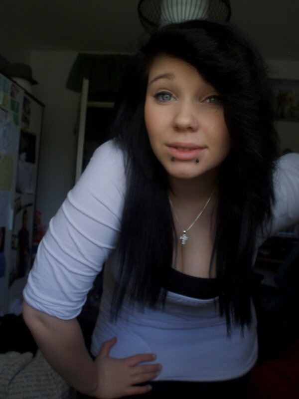 woman with dark hair and lip piercings