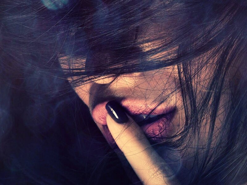 woman with dark hair and lipstick