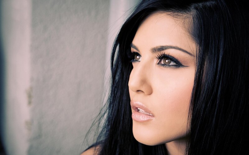 woman with dark hair and makeup