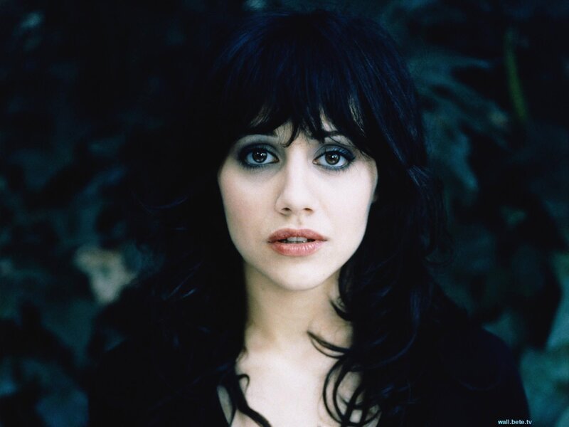 woman with dark hair and makeup