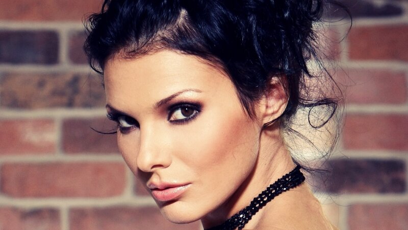 woman with dark hair and makeup