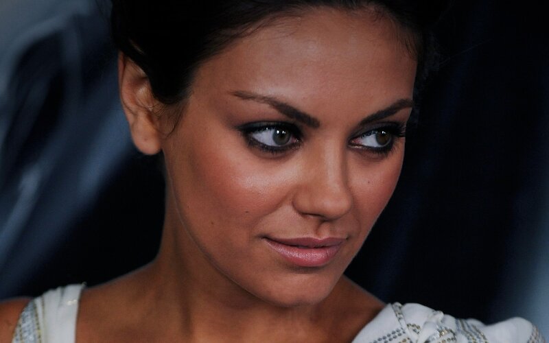 woman with dark hair and makeup