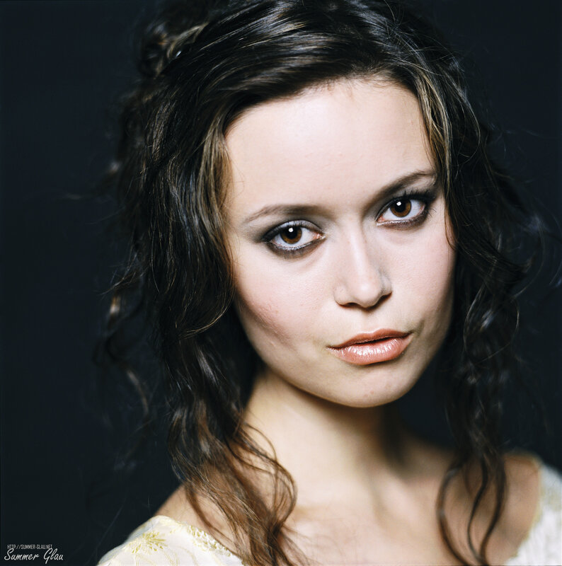 woman with dark hair and makeup