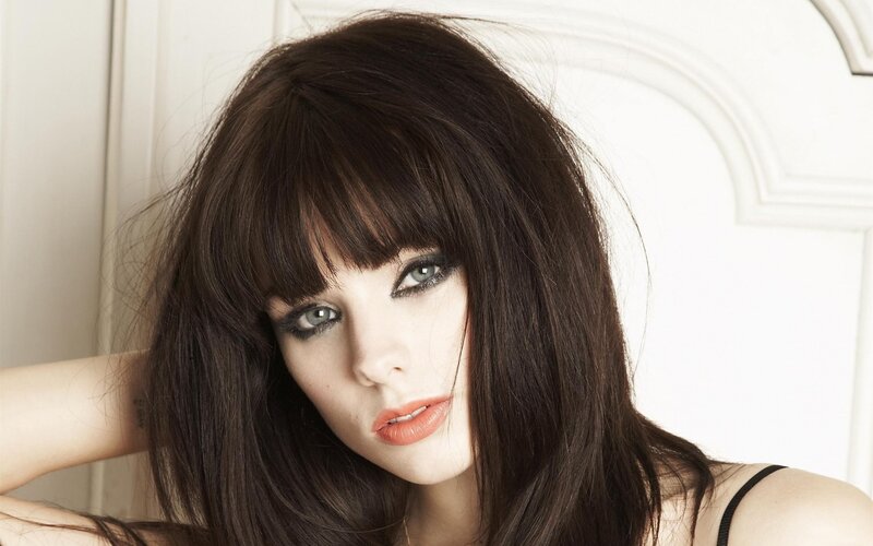 woman with dark hair and makeup