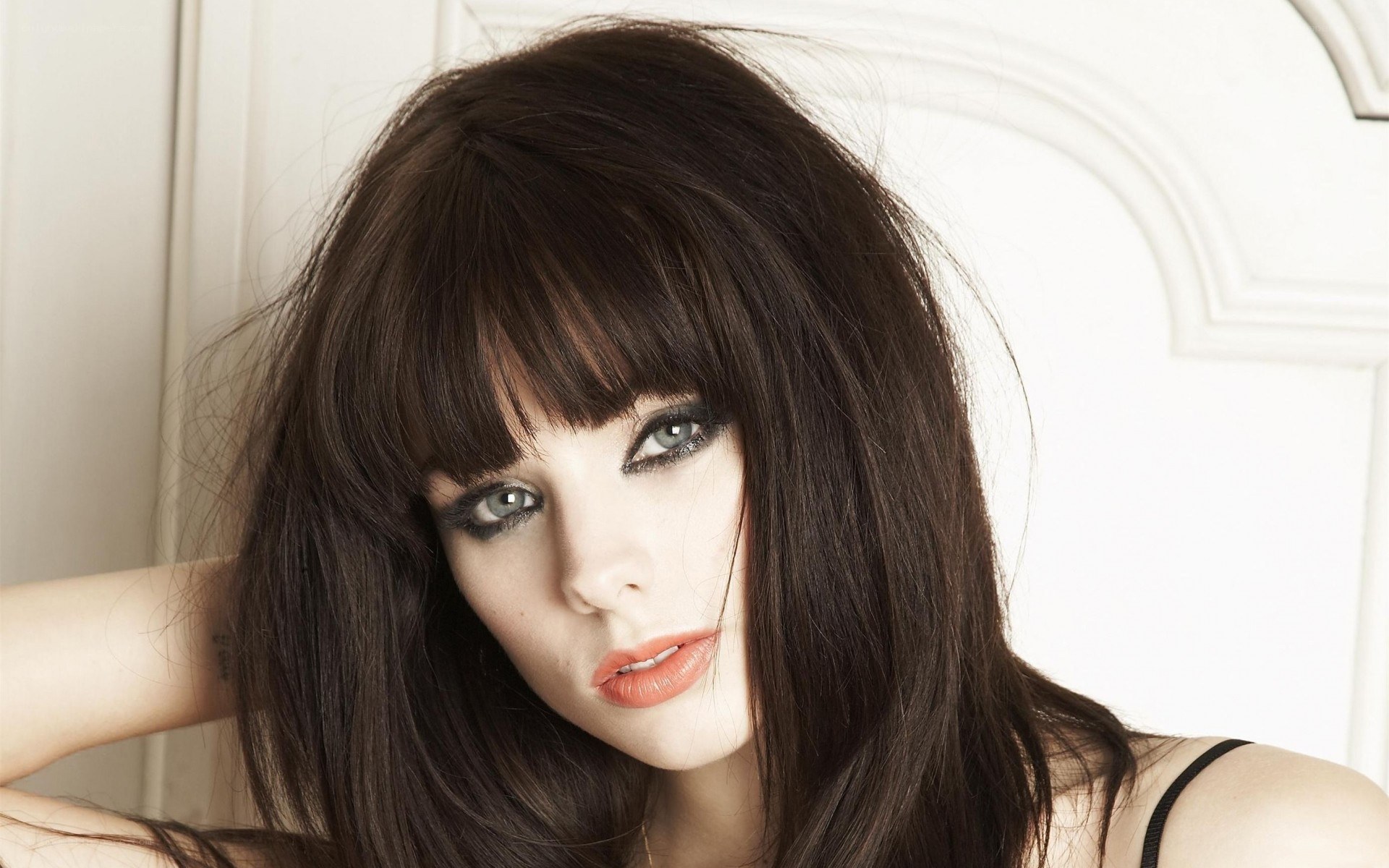 woman with dark hair and makeup