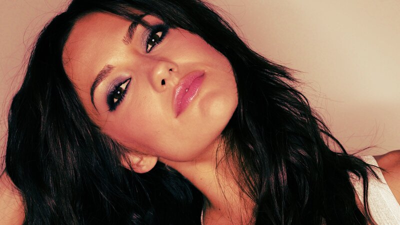 woman with dark hair and makeup