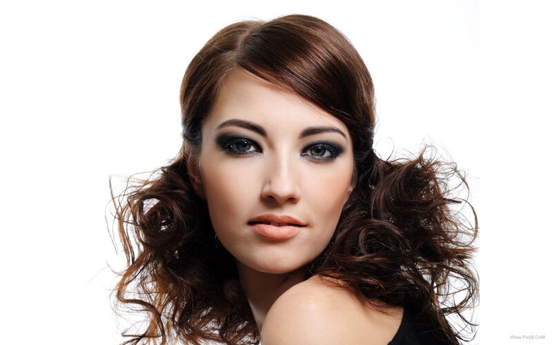 woman with dark hair and makeup