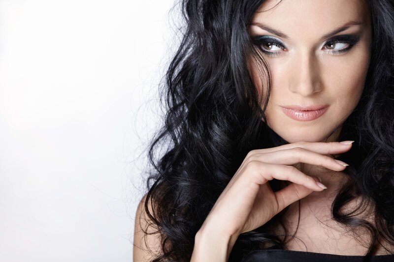 woman with dark hair and makeup