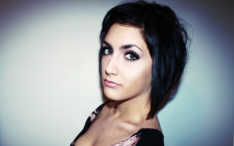 woman with dark hair and makeup