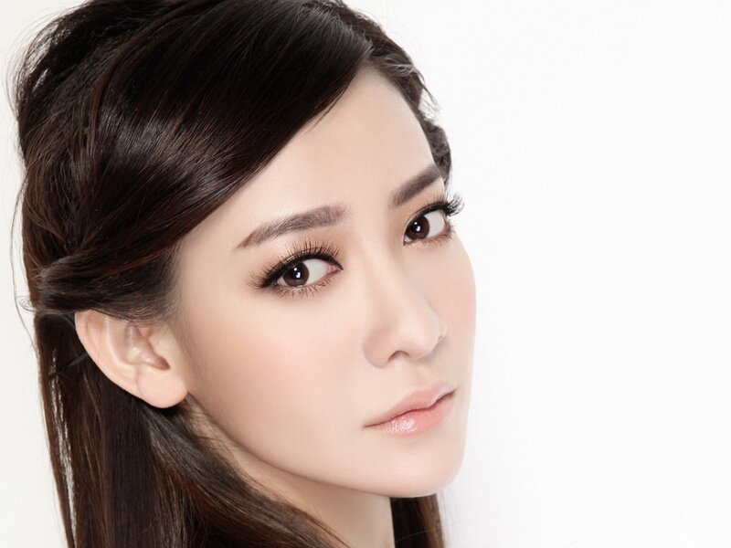 woman with dark hair and makeup