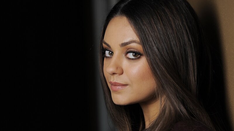 woman with dark hair and makeup