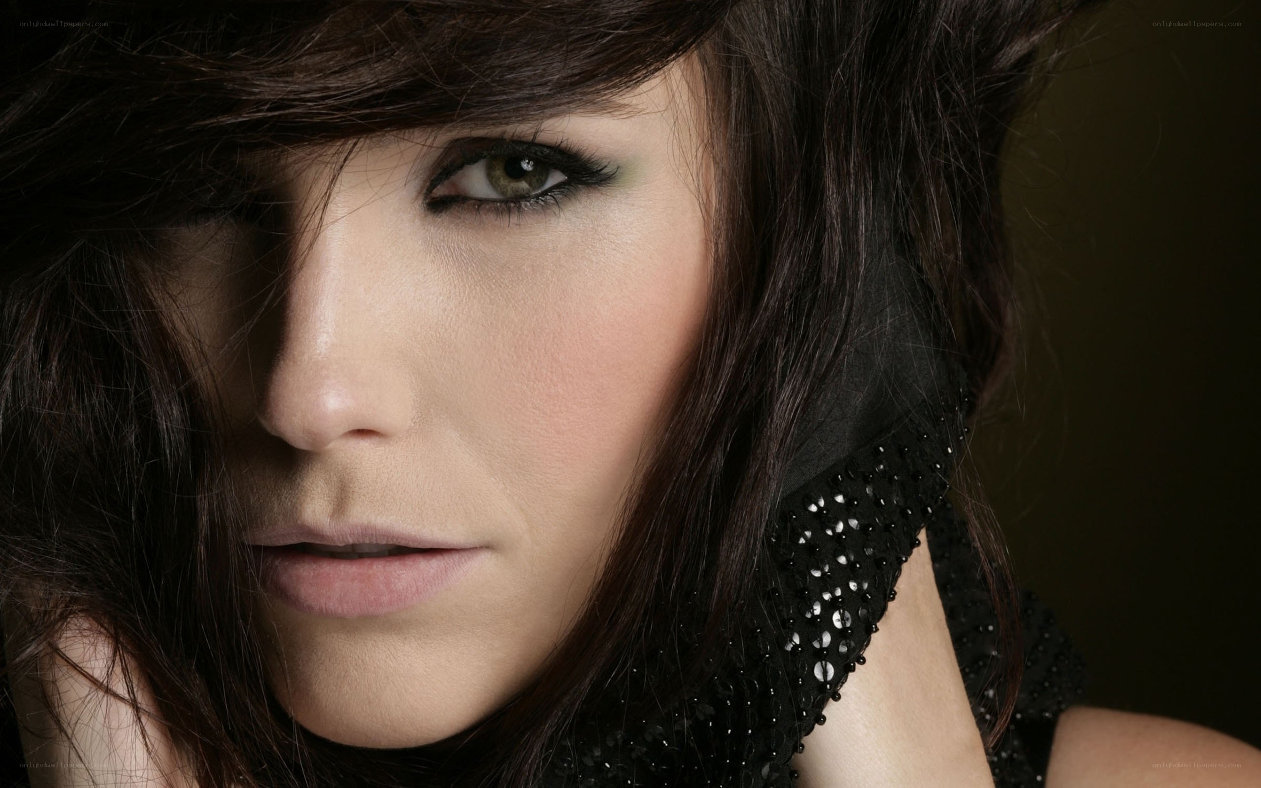 woman with dark hair and makeup