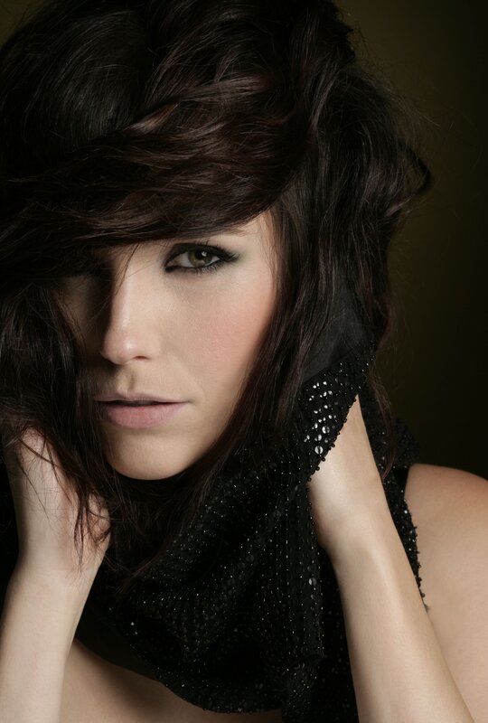 woman with dark hair and makeup