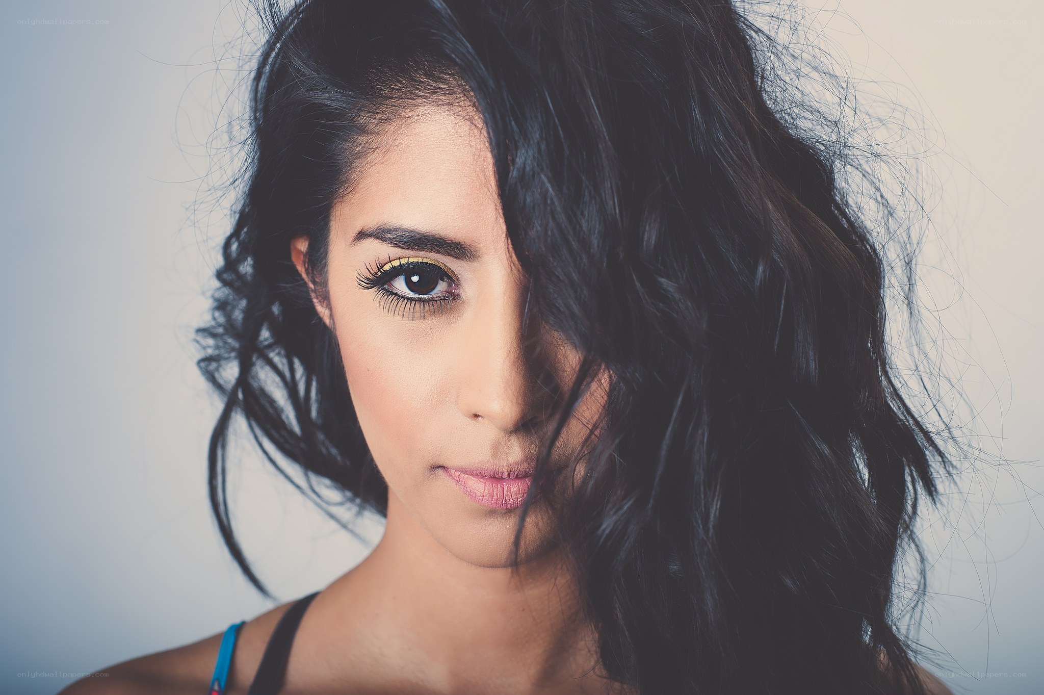 woman with dark hair and makeup