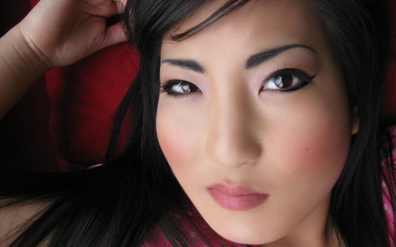 woman with dark hair and makeup