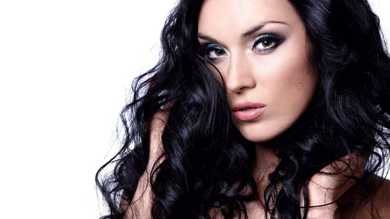 woman with dark hair and makeup