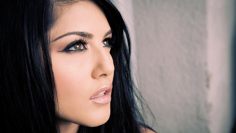 woman with dark hair and makeup