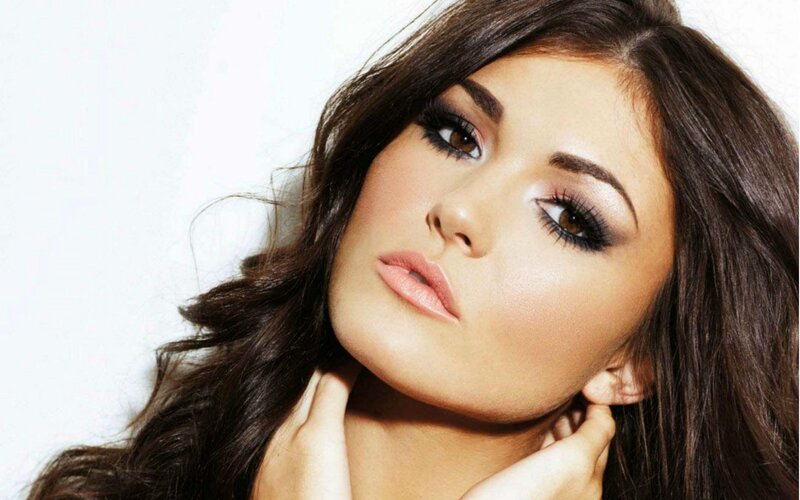 woman with dark hair and makeup
