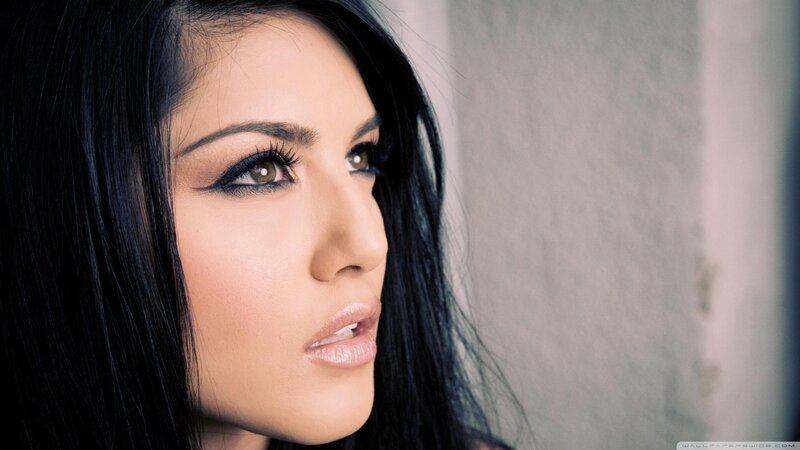 woman with dark hair and makeup