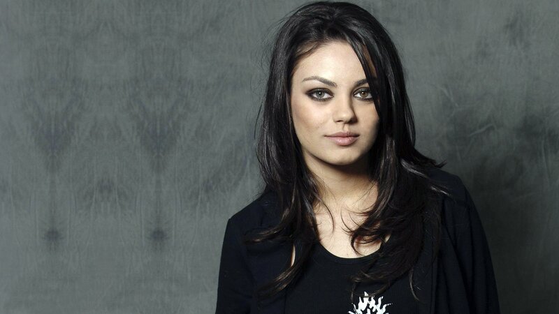 woman with dark hair and makeup