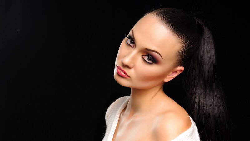 woman with dark hair and makeup