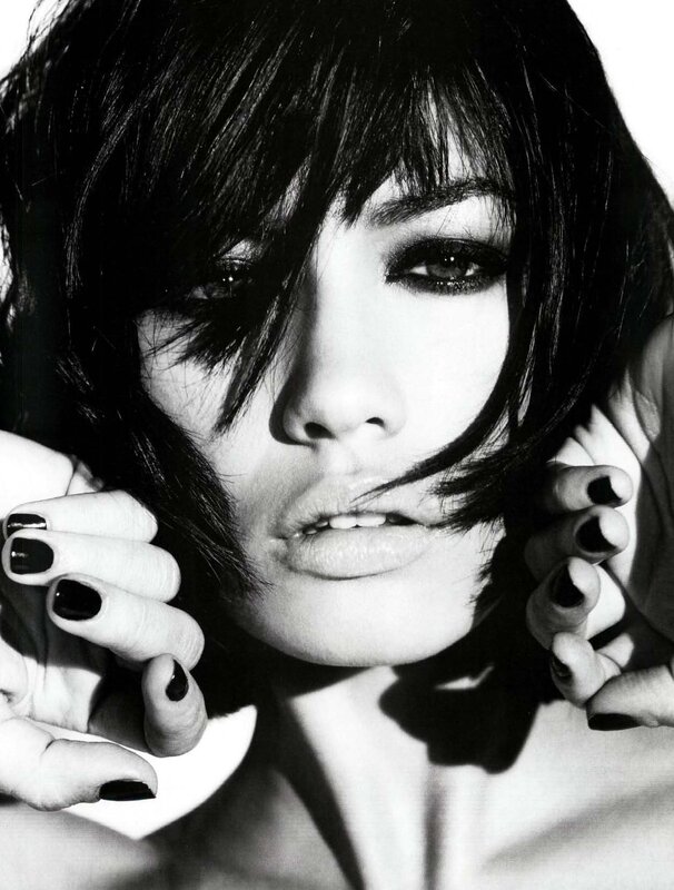 woman with dark hair and nails