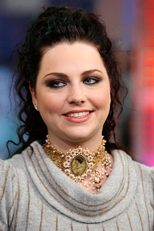 woman with dark hair and necklace