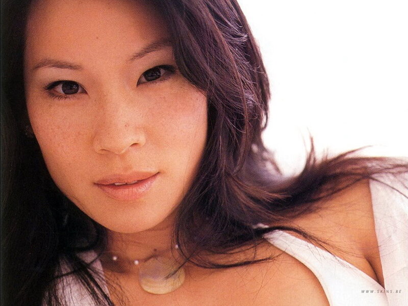 woman with dark hair and necklace