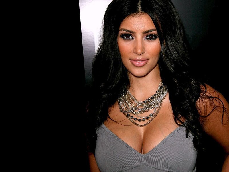woman with dark hair and necklace