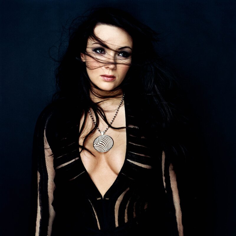 woman with dark hair and necklace