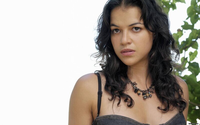 woman with dark hair and necklace