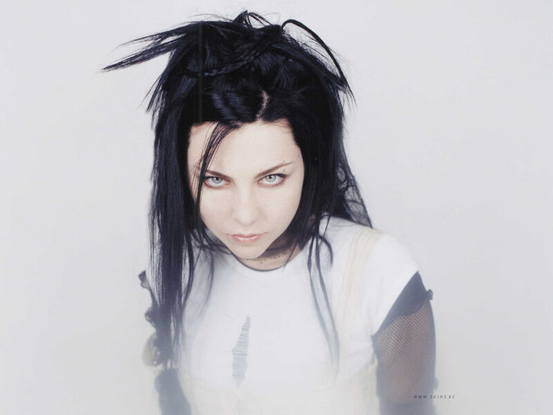 woman with dark hair and piercing gaze