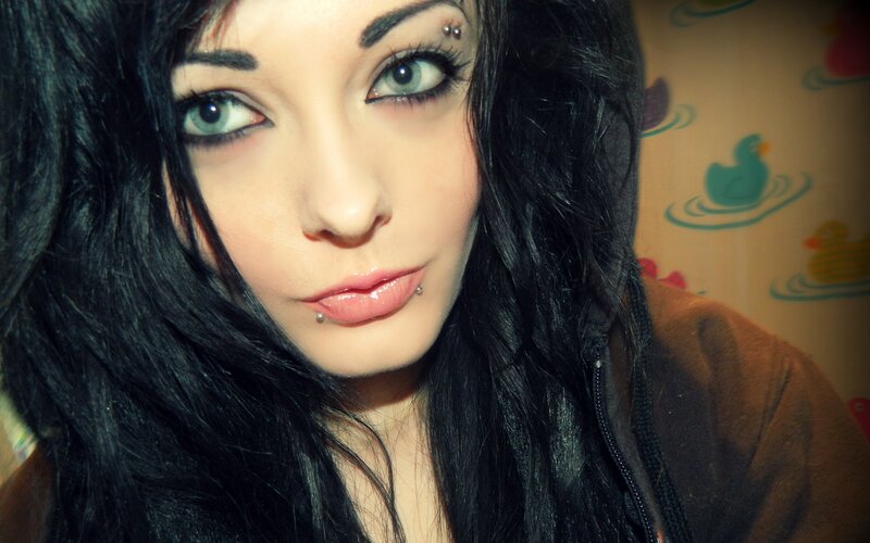 woman with dark hair and piercings