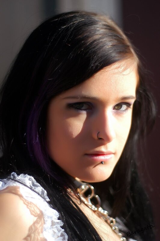 woman with dark hair and piercings