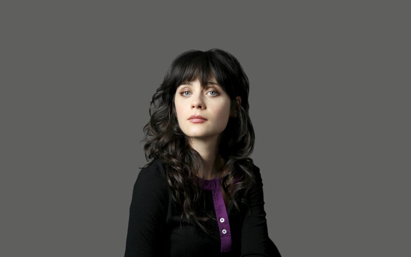 woman with dark hair and purple shirt