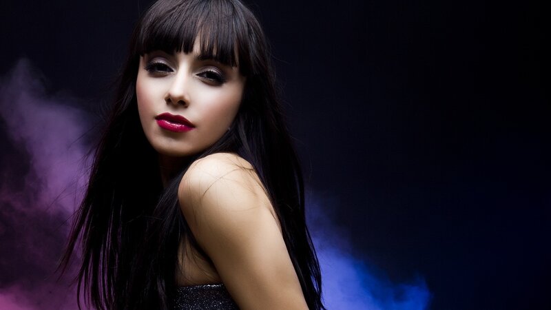 woman with dark hair and red lips
