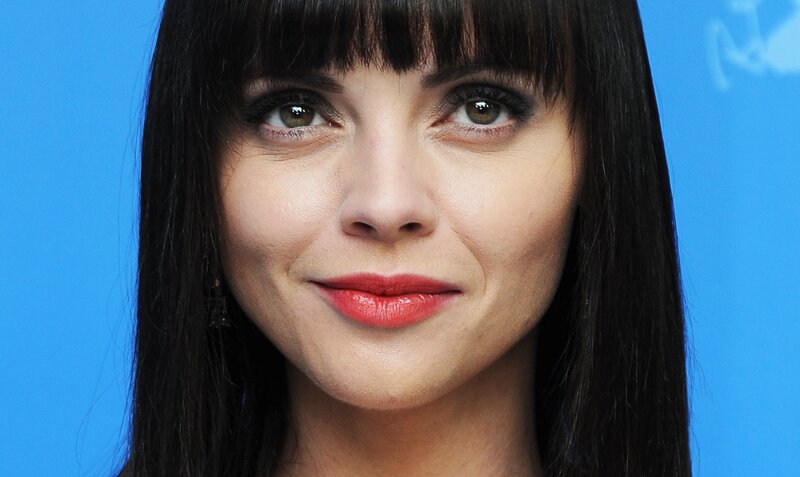 woman with dark hair and red lipstick