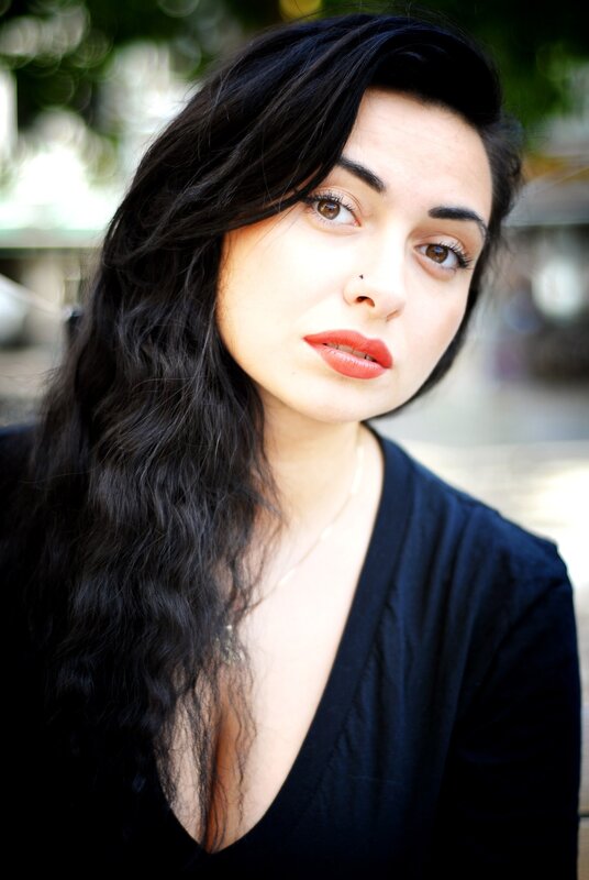 woman with dark hair and red lipstick