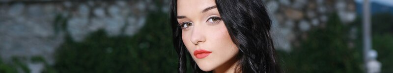 woman with dark hair and red lipstick
