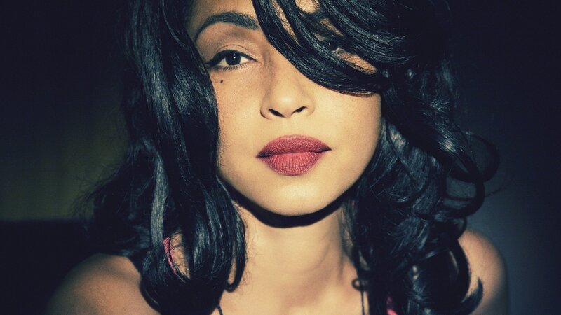 woman with dark hair and red lipstick